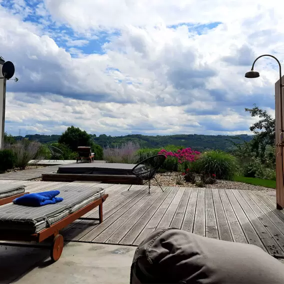 A bit of a mishmash, colorful with lots of perennials by the house, barn and beautifully integrated with the surrounding landscape